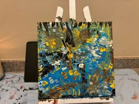 Two small blue and gold canvases side by side
