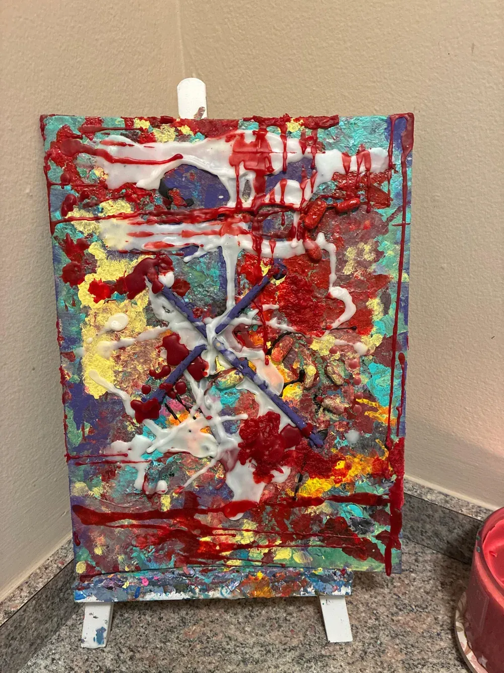 Saved — red and white strokes over a dark cross